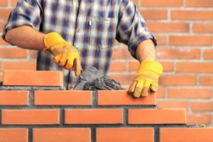 Man working on Masonry with bricks