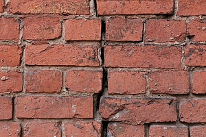 Crack going through a brick wall