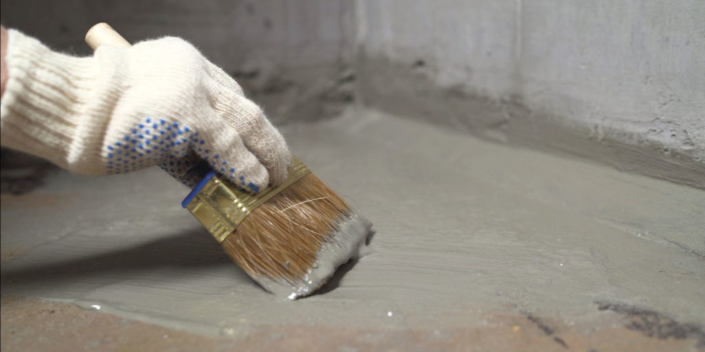 applying Cementitious Waterproofing to the floor