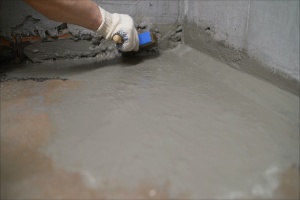 waterproofing service working on a basement