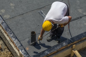 waterproofing contractor working on a roof