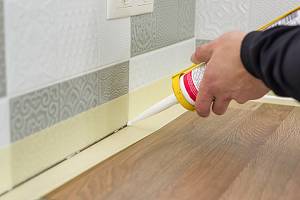 Caulk being applied on wall joints. Paper Sealing works must be done by a professional