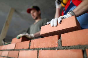builders make wall brick and cement during Masonry Repair Service