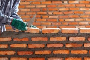 Masonry Repair worker clay masonry brick wall