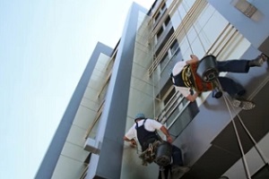 workers cleaning buildings exterior