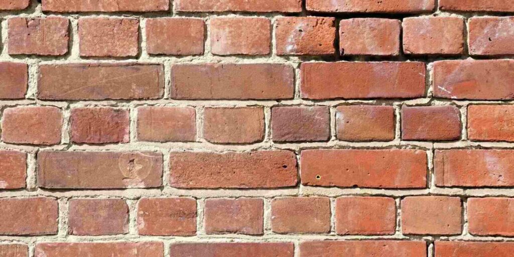 background of spalling brick wall