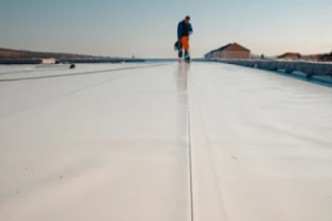 man doing waterproofing in building