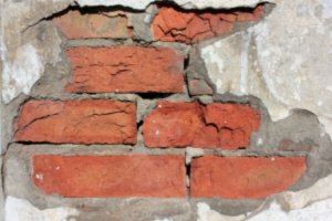 A cracked brick wall