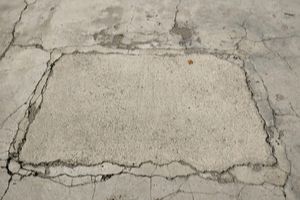 A surface of cracked concrete