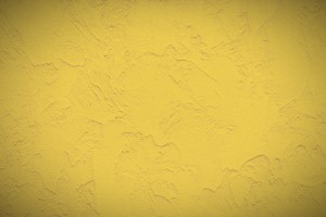yellow stucco masonry wall