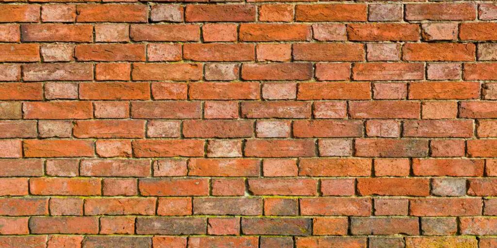 A brick wall after repointing bricks