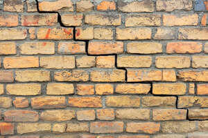 Cracks in a brick wall