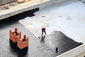 Man waterproofing PA roof for pennsylvania commercial waterproofing