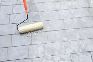 applying waterproof material to the wall in NJ