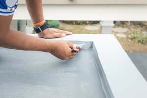 roof floor or deck painting work consist of painter man or worker person