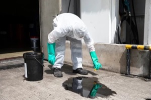 people cleaning chemical leak absorbent